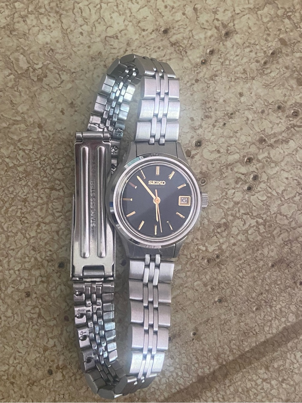 Seiko Silver Stainless Steel Watch with Black Dial and Gold Accents